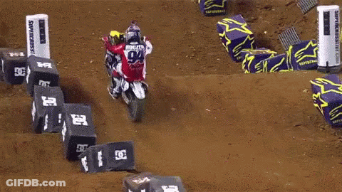 Man Jumping Dirt Bike Over Monster Energy Banner GIF