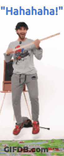 Man Jumping Holding Stick Saying Hahaha GIF
