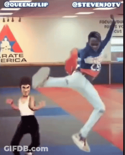Man Jumping In Front Of Karate America Sign GIF