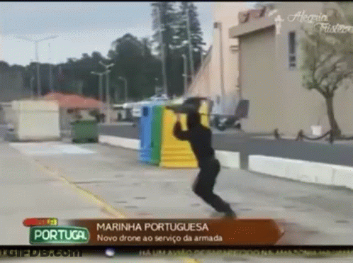 Man Jumping In Front Of Portugal Sign GIF