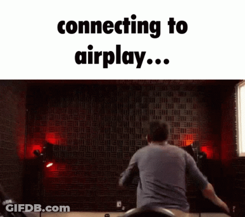 Man Jumping In Front Of Wall Saying Connecting To Airplay GIF