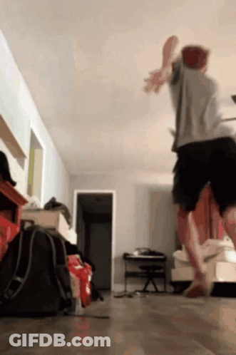Man Jumping In Living Room GIF