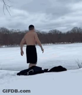 Man Jumping Into Frozen Lake GIF