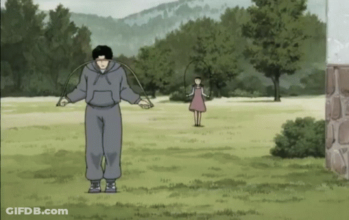 Man Jumping Jump Rope While Girl Looks On GIF