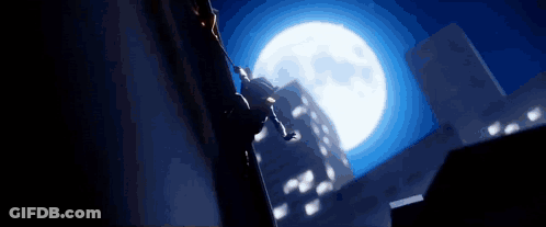Man Jumping Off Building In Front Of Full Moon GIF