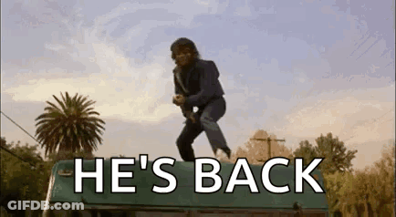 Man Jumping Off Bus Roof He's Back GIF