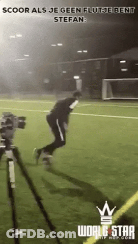Man Jumping On Soccer Field With Camera GIF
