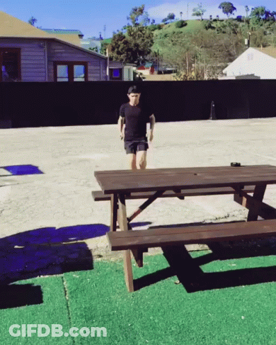 Man Jumping Over Picnic Table GIF
