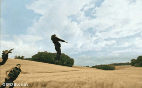 Man Jumping While Another Man Watches GIF