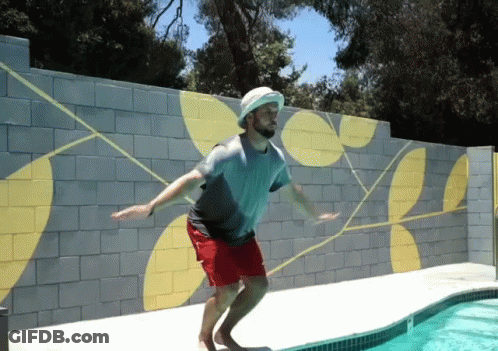 Man Jumps Into Swimming Pool With Hat GIF