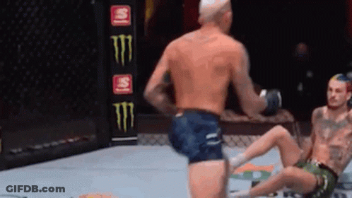 Man Kicking Another Man In Knee During Boxing Match GIF