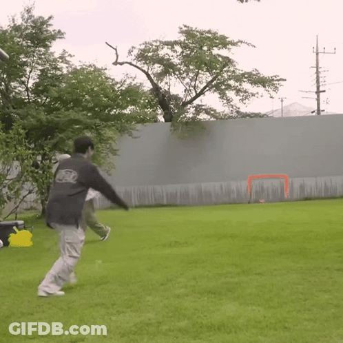 Man Kicking Ball In Abercrombie Sweatshirt GIF