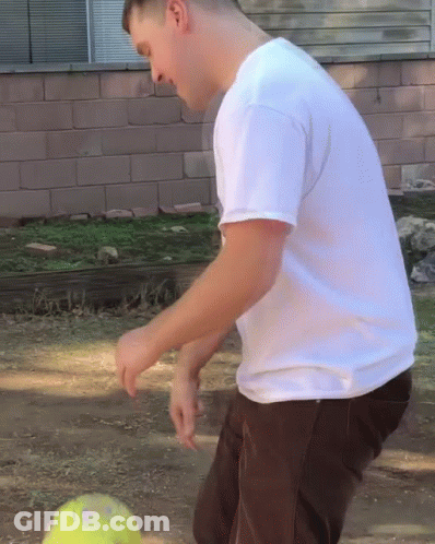 Man Kicking Ball In White Shirt GIF
