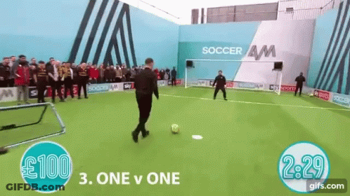 Man Kicking Soccer Ball At Soccer AM Building GIF