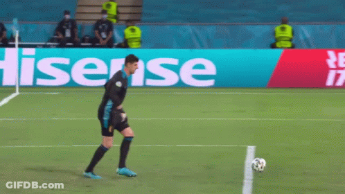 Man Kicking Soccer Ball By Hisense Sign GIF