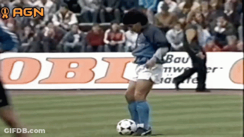 Man Kicking Soccer Ball On Field With Obi Sign GIF
