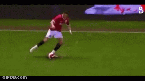 Man Kicking Soccer Ball On Soccer Field GIF