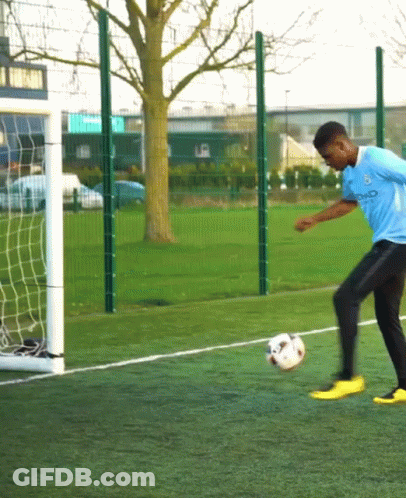 Man Kicking Soccer Ball With City Shirt GIF