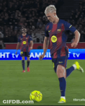Man Kicking Soccer Ball With Spotify Logo GIF