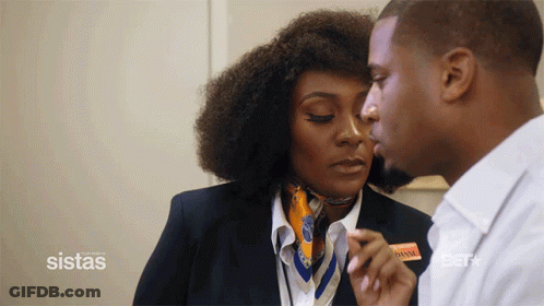 Man Kisses Woman By Sistas Sign GIF