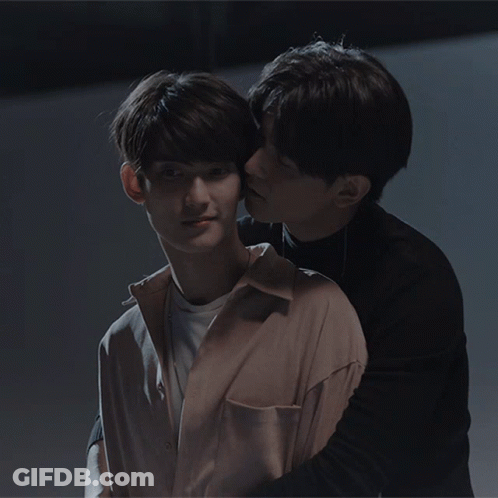 Man Kissing Another Man On Cheek GIF