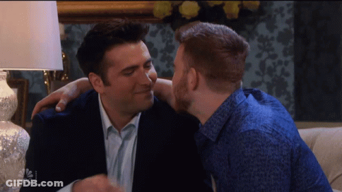 Man Kissing Another Man On Cheek NBC GIF