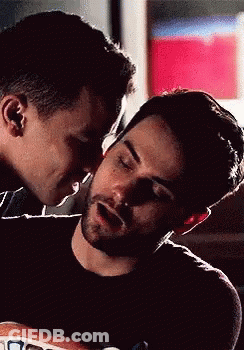 Man Kissing Another On Forehead GIF