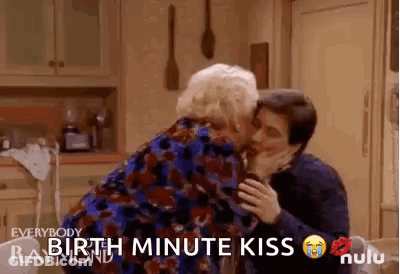 Man Kissing Older Woman On Cheek GIF