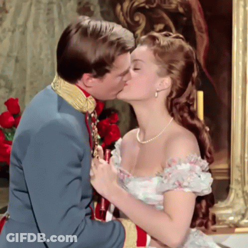 Man Kissing Woman In White Dress GIF