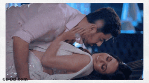 Man Kissing Woman Laying On Floor GIF