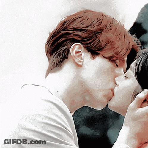Man Kissing Woman On Cheek GIF
