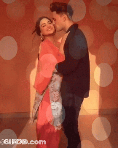 Man Kissing Woman On Cheek GIF