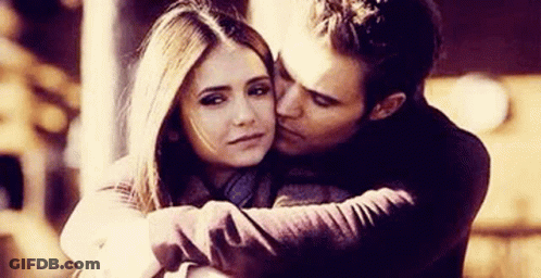 Man Kissing Woman On Cheek GIF
