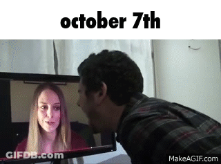 Man Kissing Woman On Cheek Looking At October 7Th Screen GIF