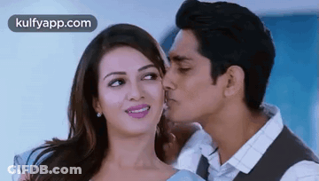 Man Kissing Woman On Cheek GIF