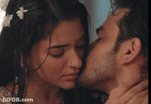 Man Kissing Woman On Cheek With Nose Ring GIF