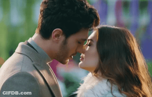Man Kissing Woman On Forehead GIF