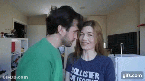 Man Kissing Woman On Forehead GIF