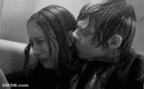 Man Kissing Woman On Forehead Black And White GIF