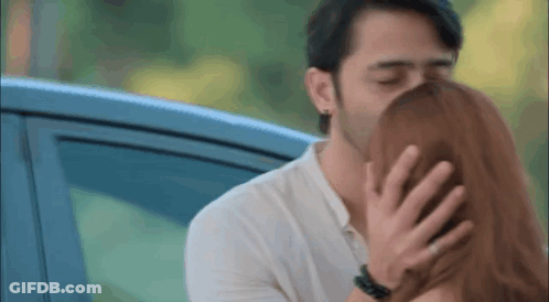 Man Kissing Woman On Forehead GIF