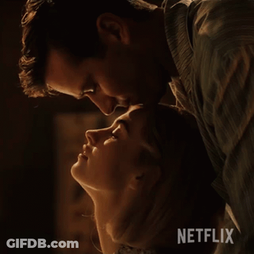 Man Kissing Woman On Forehead With Netflix Logo GIF