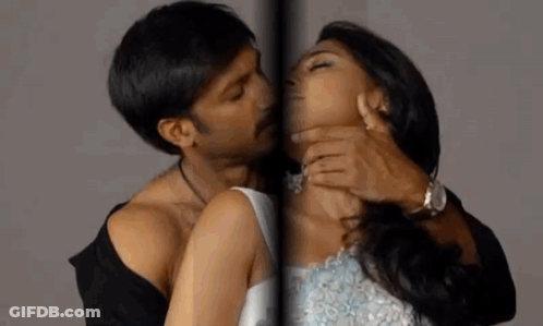 Man Kissing Woman On Neck GIF