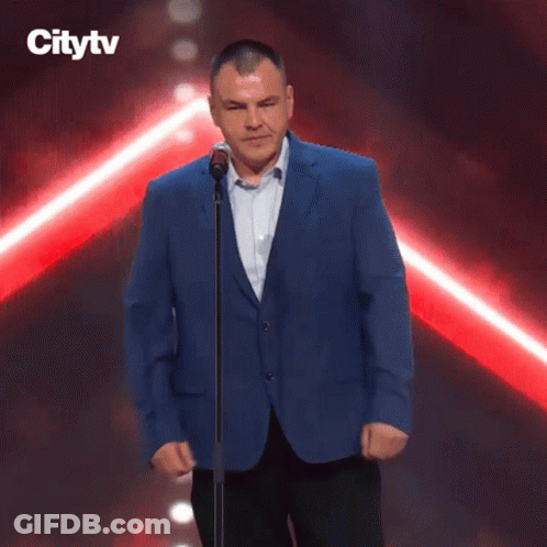Man Kneeling At Microphone With Citytv Logo GIF