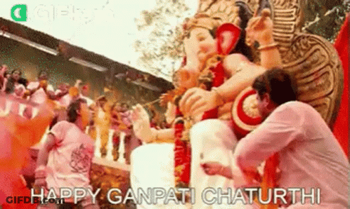 Man Kneeling Before Deity Statue GIF
