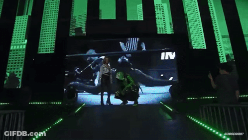 Man Kneeling Before Eddie Estrada Sign GIF