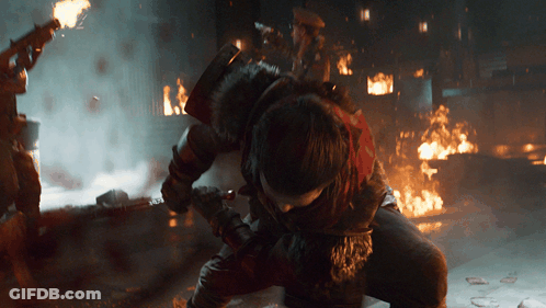 Man Kneeling Before Fire With Sword GIF