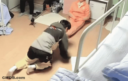Man Kneeling Before Woman On Hospital Bed GIF