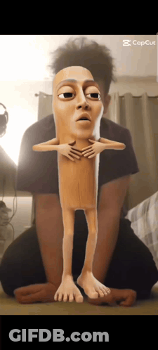 Man Kneeling Beside Cartoon Sausage Stick GIF