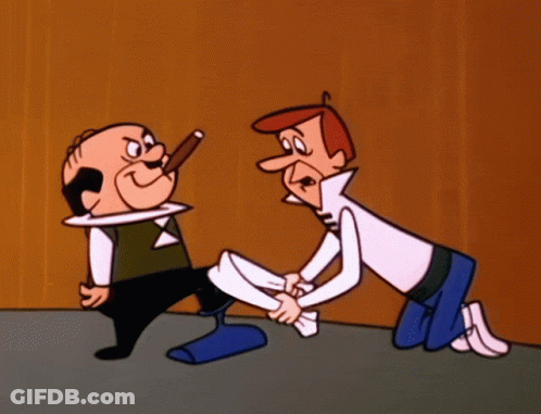 Man Kneeling Holding Another Man's Leg GIF