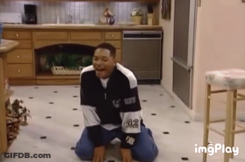 Man Kneeling In Black And White Sweater 32 GIF